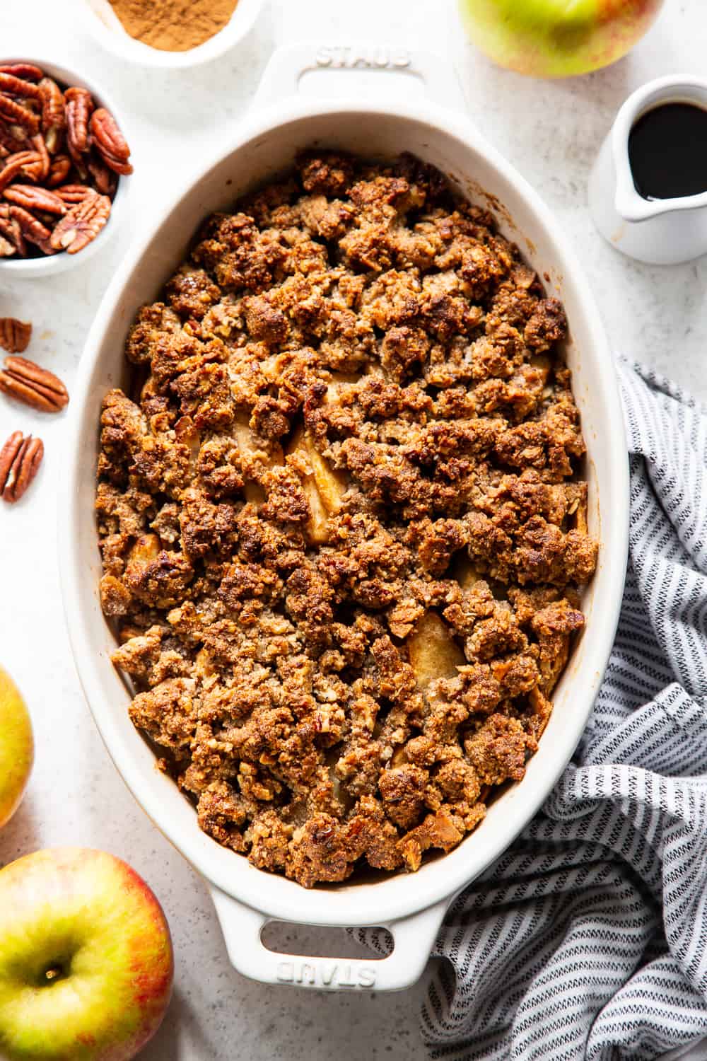 A healthy version of a classic fall dessert, this Paleo Maple Pecan Apple Crisp is the perfect warm and sweet comfort food on cozy nights.  It's grain free, gluten free, paleo, vegan, and soy free with simple whole ingredients and the fall flavors you crave. #paleo #vegan #cleaneating #applecrisp #healthybaking