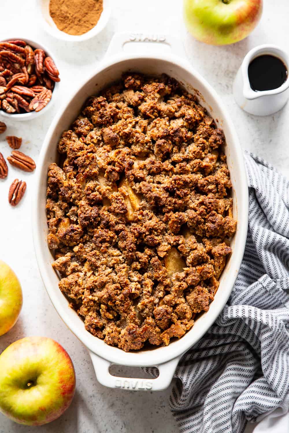 A healthy version of a classic fall dessert, this Paleo Maple Pecan Apple Crisp is the perfect warm and sweet comfort food on cozy nights.  It's grain free, gluten free, paleo, vegan, and soy free with simple whole ingredients and the fall flavors you crave. #paleo #vegan #cleaneating #applecrisp #healthybaking