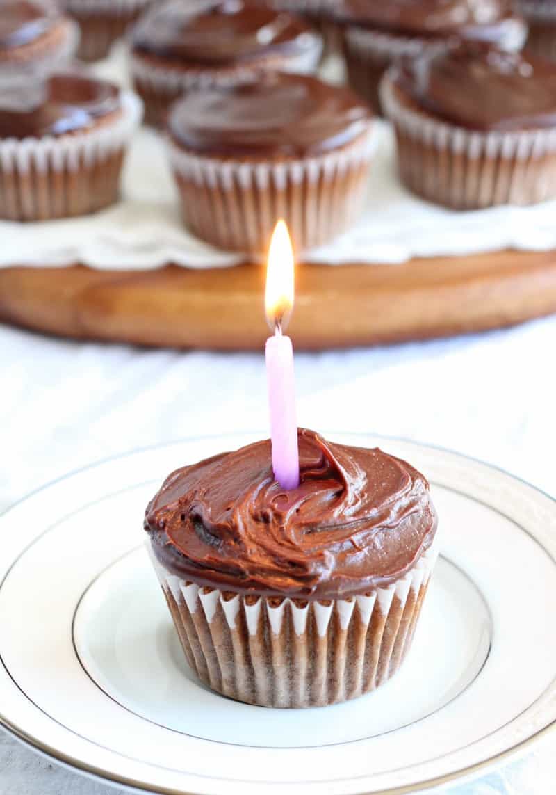 vanilla cupcake with candle and chocolate