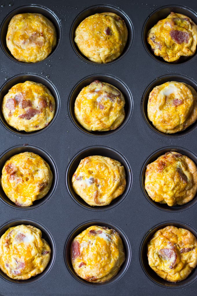 sweet potato and bacon egg muffins in a muffin pan