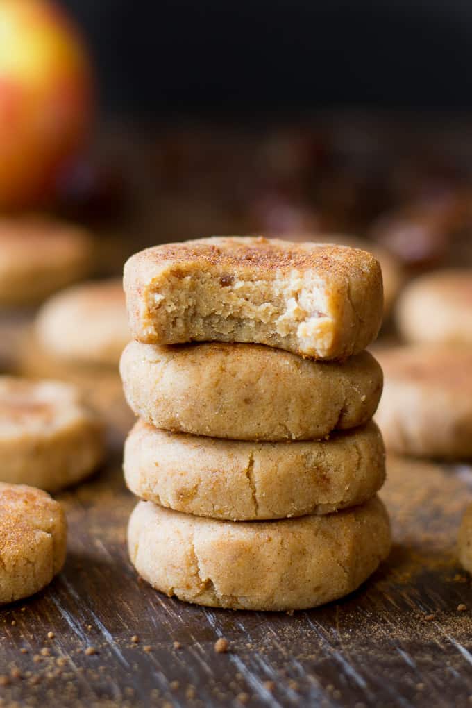 closeup photo of a stack of four cookies, a bite taken from the cookie on top