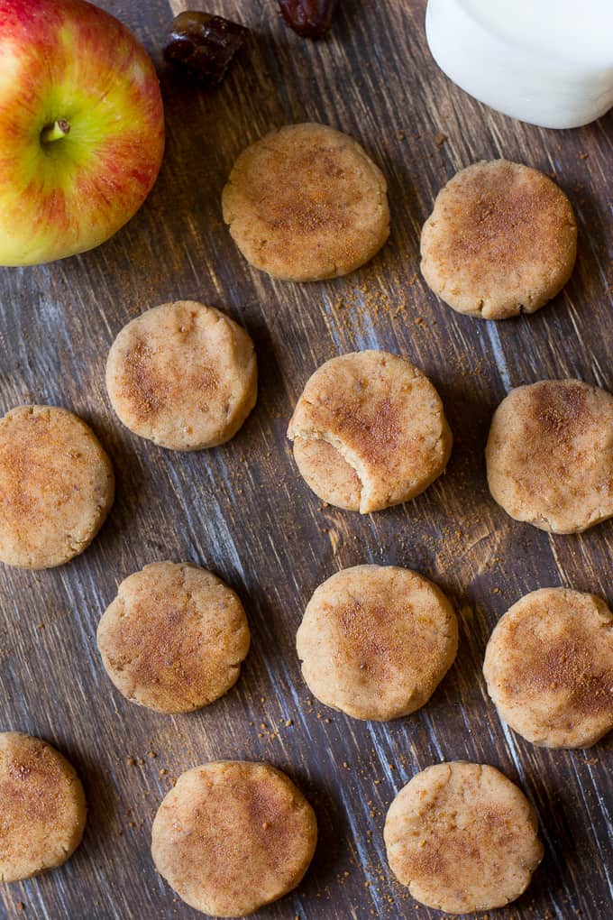 no bake apple cookies arranged on a board with an apple in the top left corner