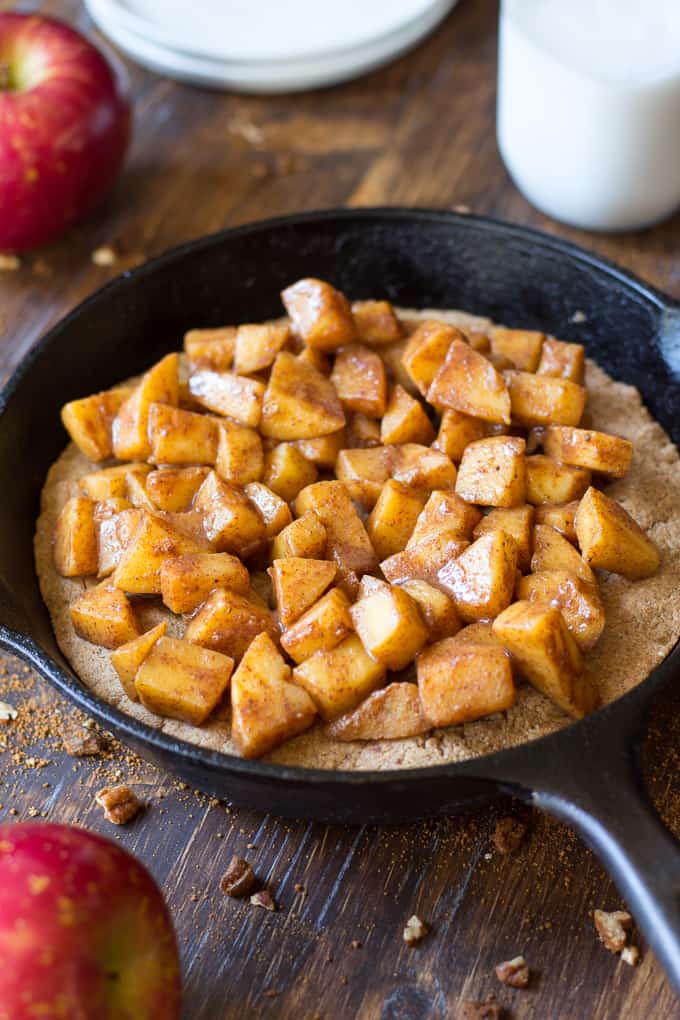 apple pie snickerdoodle skillet cookie in a cast iron skillet