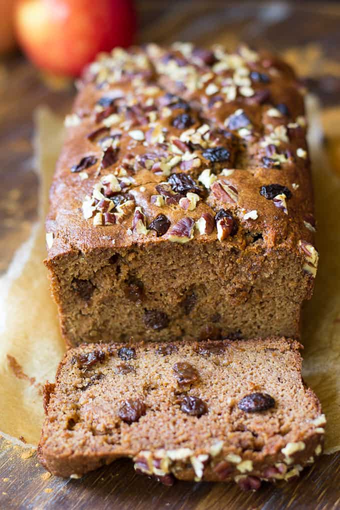 a loaf of Paleo cinnamon raisin breakfast bread with one slice off the end