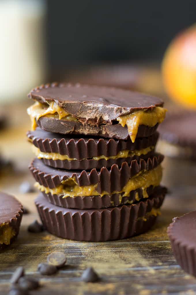 stack of four pumpkin pie caramel cups with a bite taken from the top cup