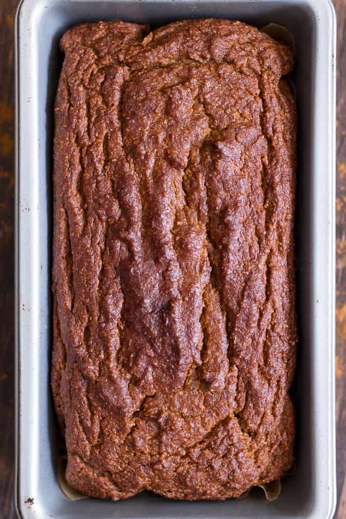 a baked loaf of pumpkin bread in a bread pan