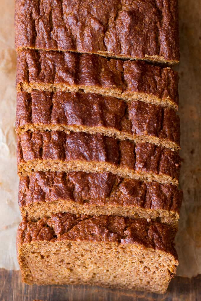 a loaf of baked Paleo pumpkin bread cut into slices