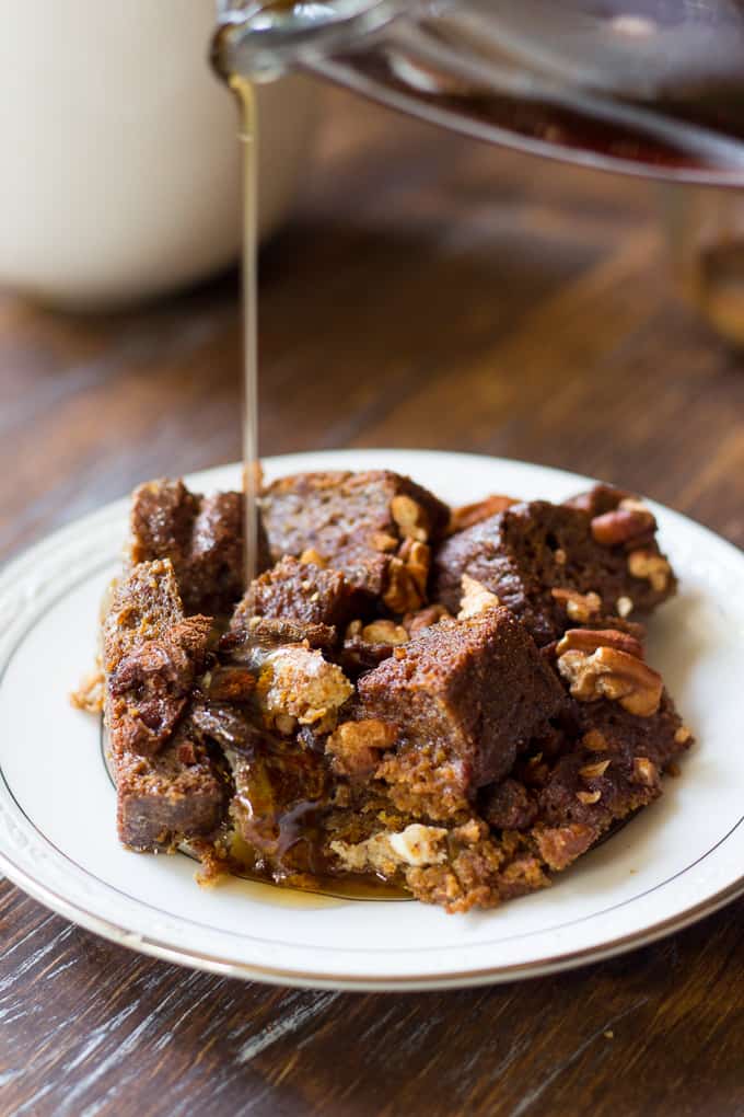 syrup pouring over a serving of paleo pumpkin french toast bake 