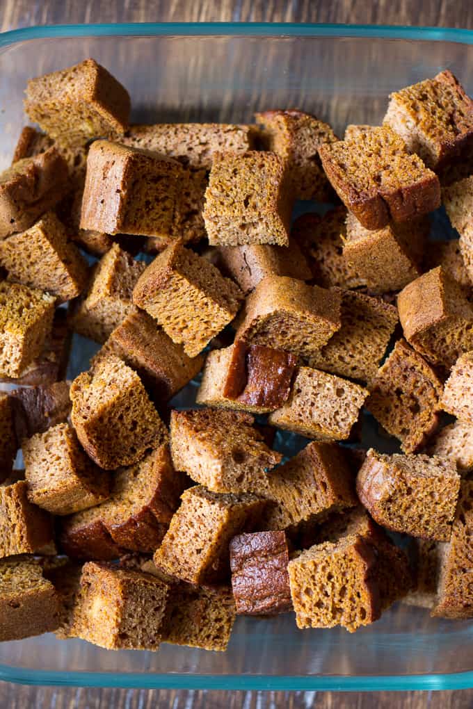 cubes of grain free pumpkin bread in a glass baking dish