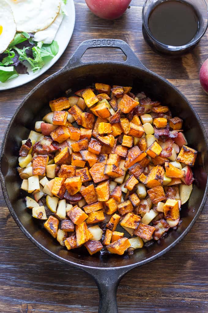 baked diced butternut squash, apples, and bacon in a skillet