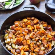 butternut squash and bacon apple hash in an iron skillet