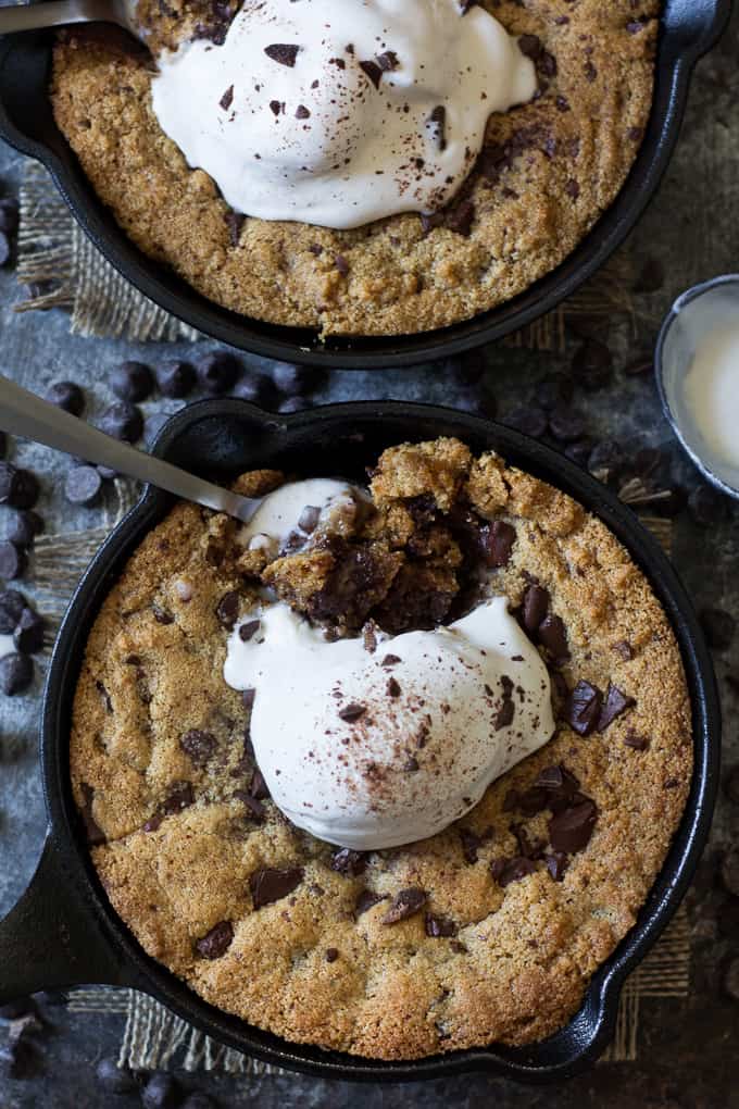 Paleo chocolate chip skillet cookies that are easy to make, rich and fudgy and packed with chocolate! Grain free, dairy free, gluten free, Paleo. Add coconut ice cream for the ultimate Paleo dessert!