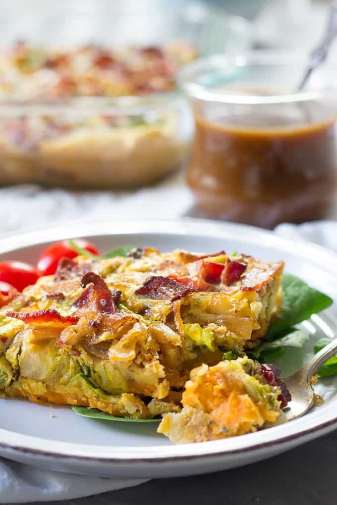 a forkful and a slice of bacon and brussels sprout breakfast casserole 