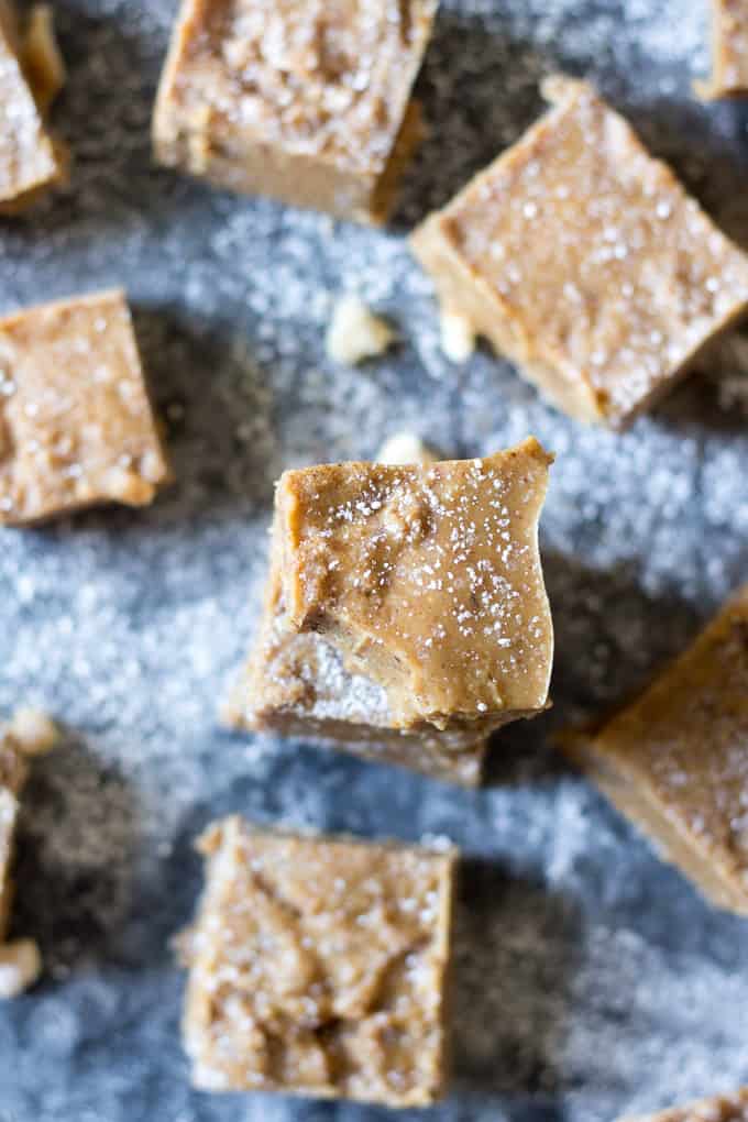 This creamy, rich and sweet Vanilla Sugar Cookie Dough Fudge is secretly healthy for you but you'd never guess! Paleo and vegan sugar cookie dough is swirled through vanilla fudge, then chilled to achieve the perfect texture. Great for the holidays or anytime!