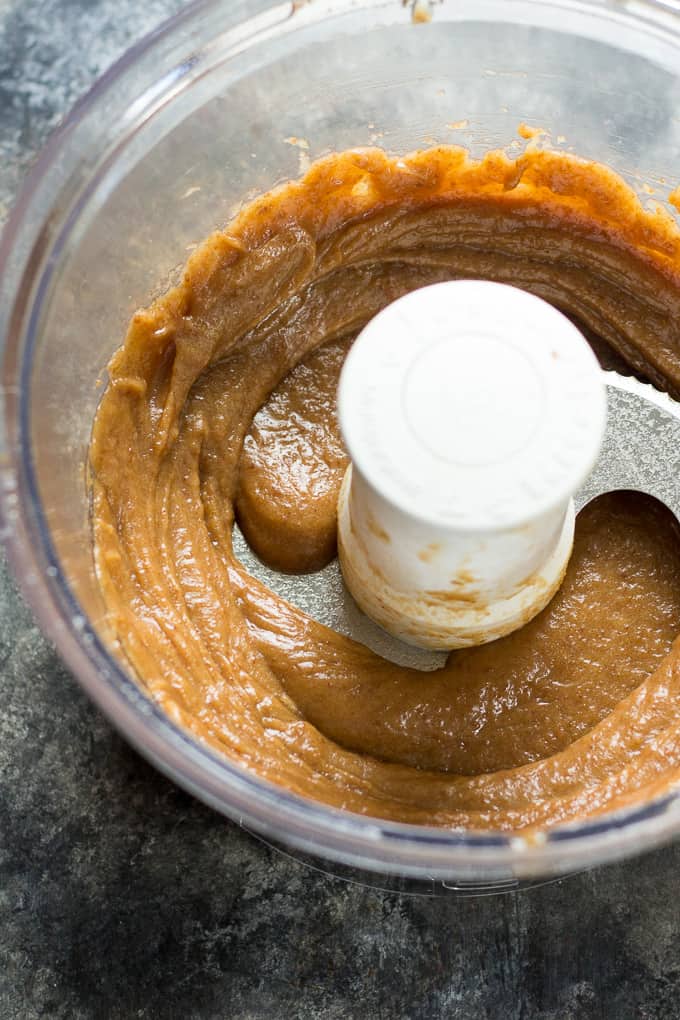 caramel candy filling swirled in the bowl of a food processor