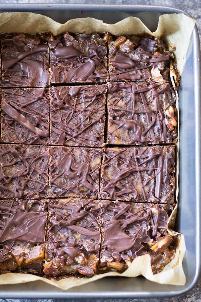 Turtle Bars with a chewy chocolate cookie layer, gooey caramel pecan layer and creamy chocolate shell! Gluten free, grain free, dairy free and makes a great holiday dessert!