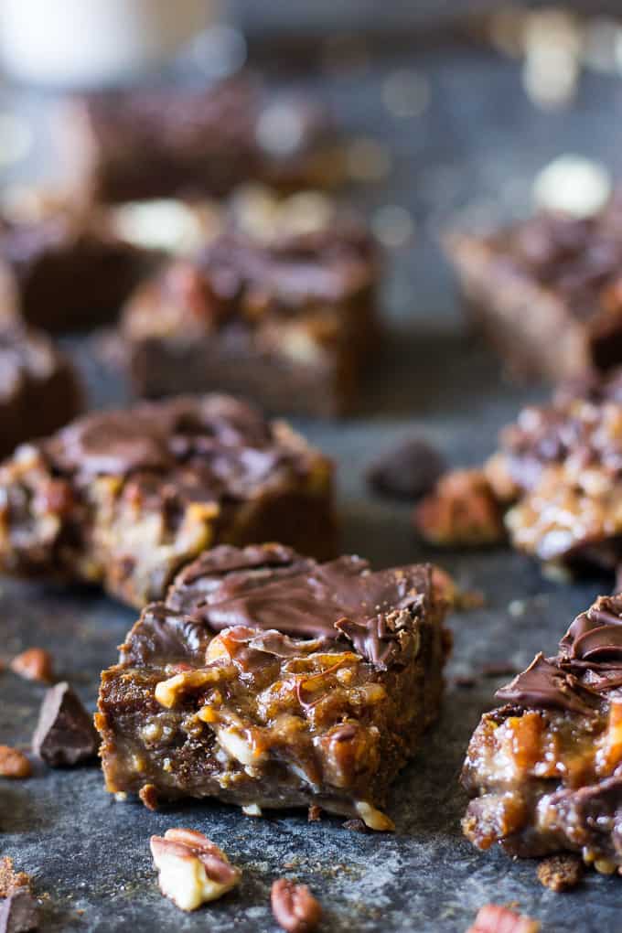 Turtle Bars with a chewy chocolate cookie layer, gooey caramel pecan layer and creamy chocolate shell! Gluten free, grain free, dairy free and makes a great holiday dessert!