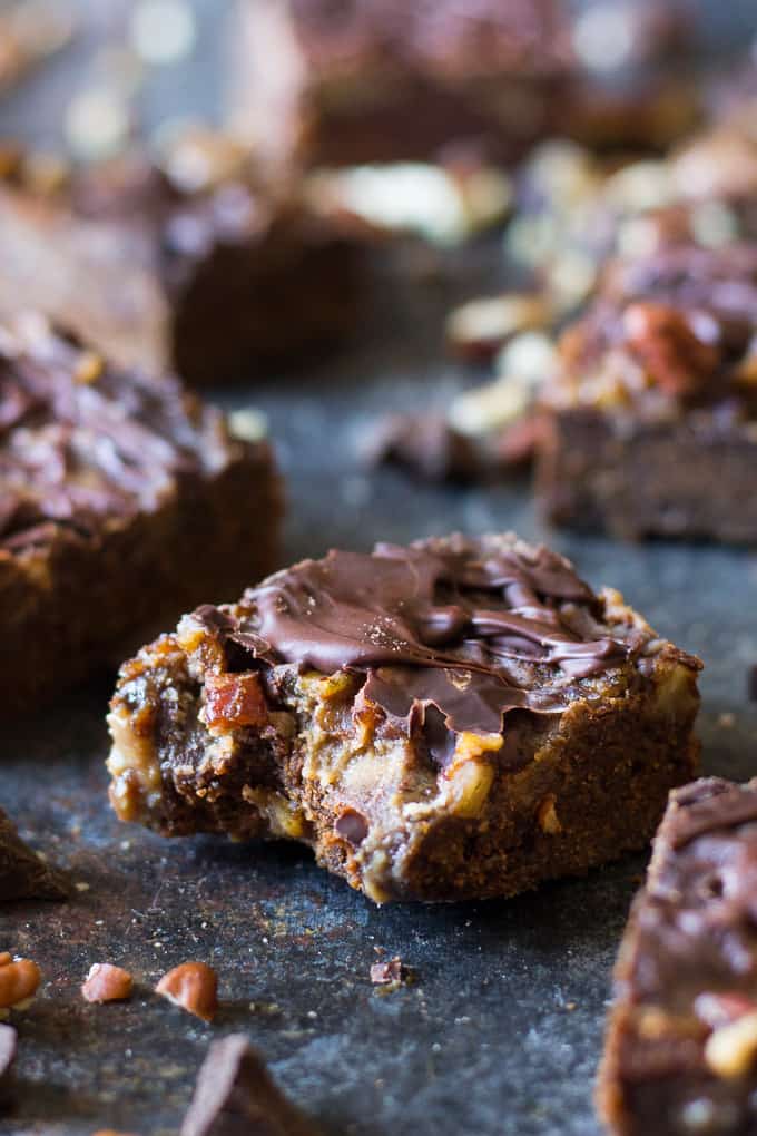 Turtle Bars with a chewy chocolate cookie layer, gooey caramel pecan layer and creamy chocolate shell! Gluten free, grain free, dairy free and makes a great holiday dessert!