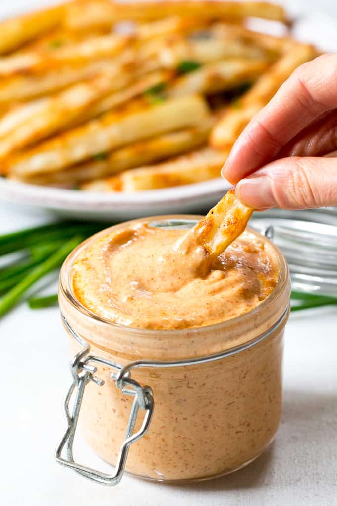 Easy to make crispy baked french fries with a spicy chipotle ranch dip that's Paleo and Whole30 compliant! Serve these baked french fries as a fun and healthy side dish, appetizer or snack.