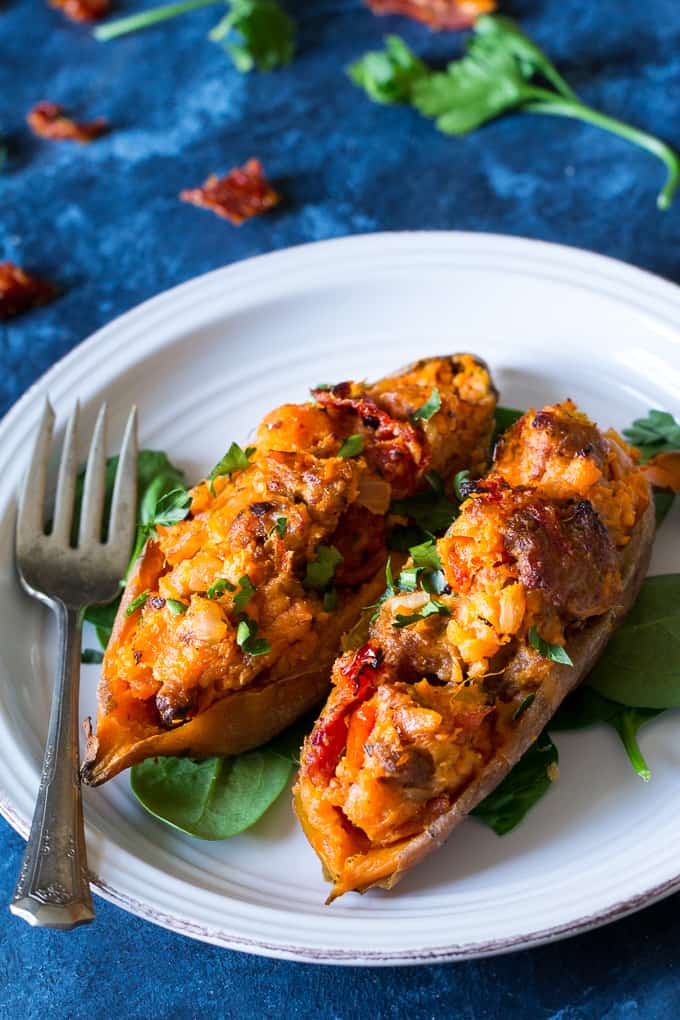 These are the ultimate Paleo and Whole30 Twice Baked Sweet Potatoes! With an addicting filling that tastes just like sausage pizza, they're a great weeknight dinner (do the first baking ahead of time), healthy, filling, and kid friendly.