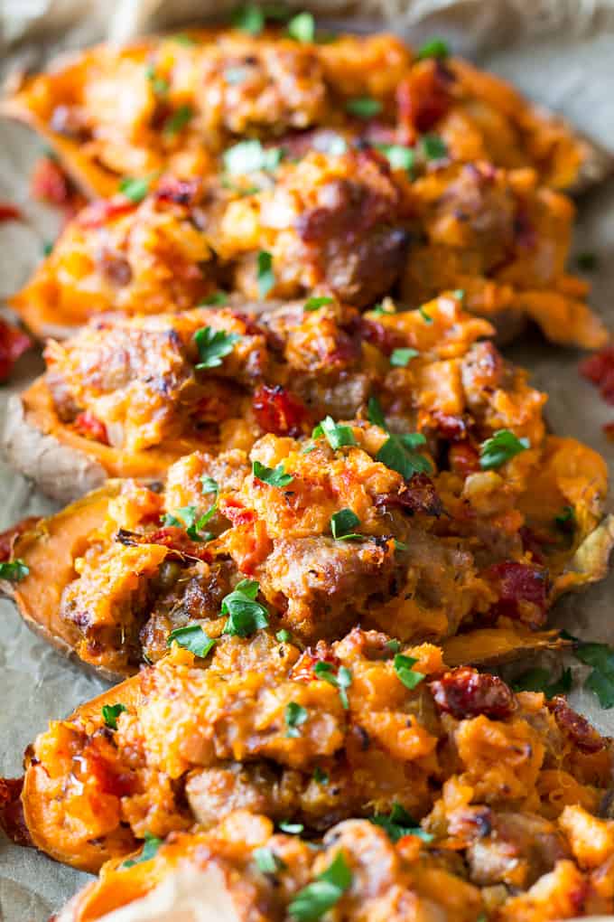 These are the ultimate Paleo and Whole30 Twice Baked Sweet Potatoes! With an addicting filling that tastes just like sausage pizza, they're a great weeknight dinner (do the first baking ahead of time), healthy, filling, and kid friendly.