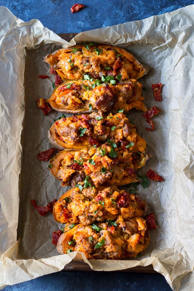 These are the ultimate Paleo and Whole30 Twice Baked Sweet Potatoes! With an addicting filling that tastes just like sausage pizza, they're a great weeknight dinner (do the first baking ahead of time), healthy, filling, and kid friendly.