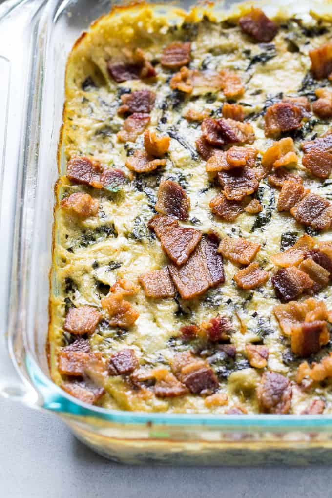 Creamy Baked Spinach Artichoke Dip that you won't believe is dairy free! Super creamy and packed with flavor, this dip is great for veggies, chips, and as a topping or spread for potatoes, chicken and burgers. Paleo & Whole30 compliant.