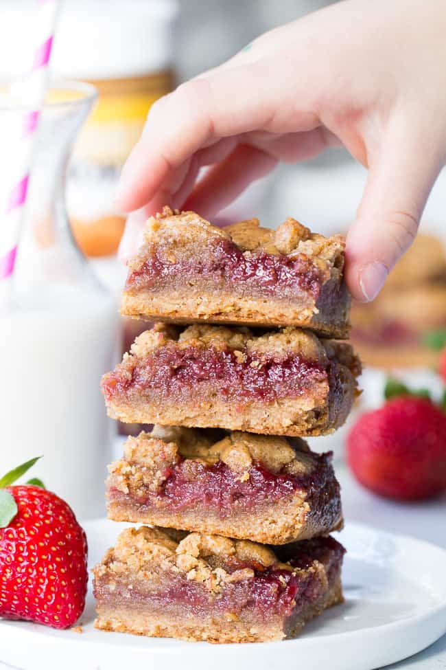 These gooey, sweet, and perfectly chewy Almond Butter and Jelly Cookie Bars are a great treat to have around for a heathy snack or dessert. They're paleo, vegan, gluten-free, easy to make and total comfort food!