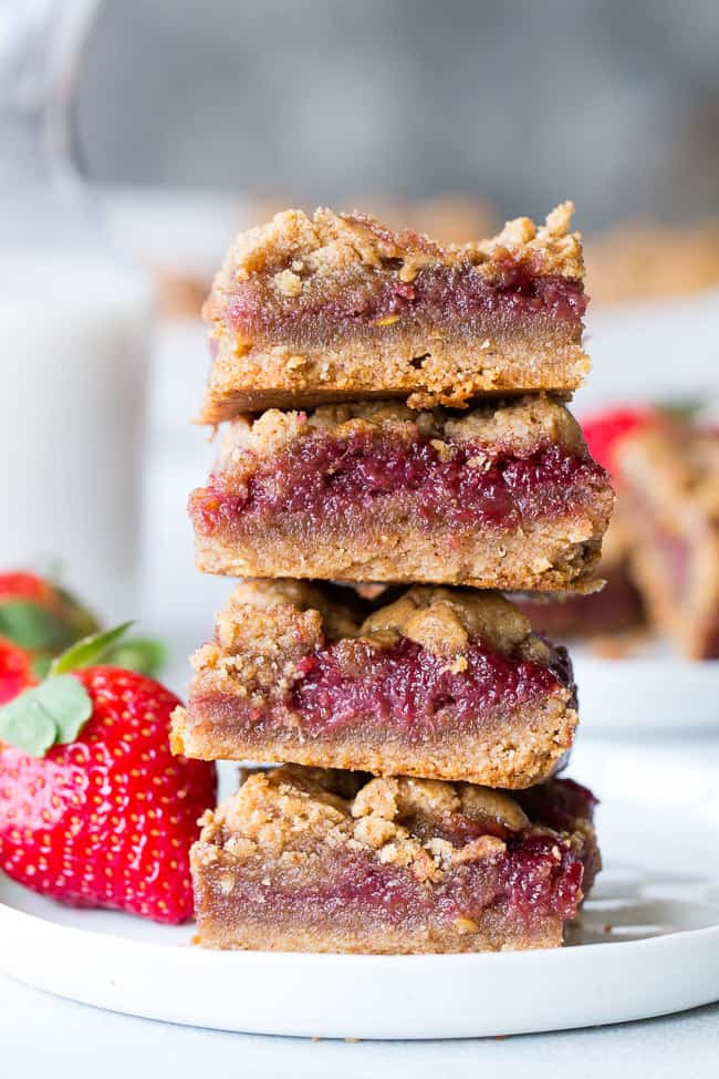 These gooey, sweet, and perfectly chewy Almond Butter and Jelly Cookie Bars are a great treat to have around for a heathy snack or dessert. They're paleo, vegan, gluten-free, easy to make and total comfort food!