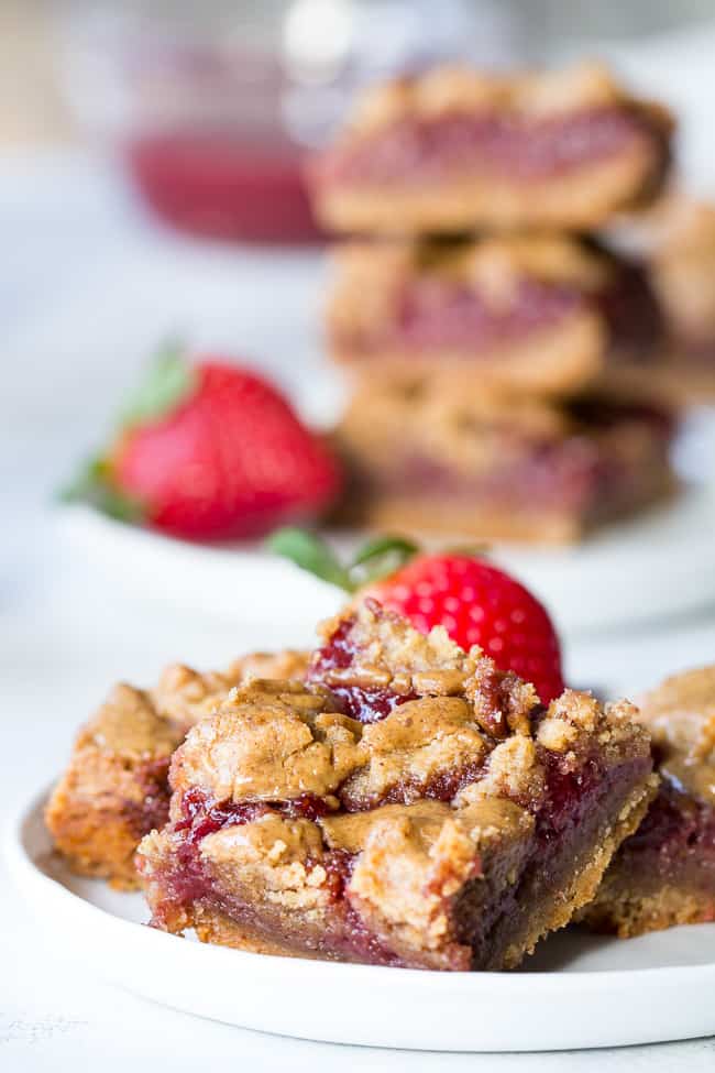 These gooey, sweet, and perfectly chewy Almond Butter and Jelly Cookie Bars are a great treat to have around for a heathy snack or dessert. They're paleo, vegan, gluten-free, easy to make and total comfort food!