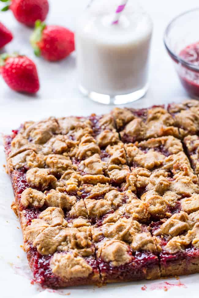 These gooey, sweet, and perfectly chewy Almond Butter and Jelly Cookie Bars are a great treat to have around for a heathy snack or dessert. They're paleo, vegan, gluten-free, easy to make and total comfort food!