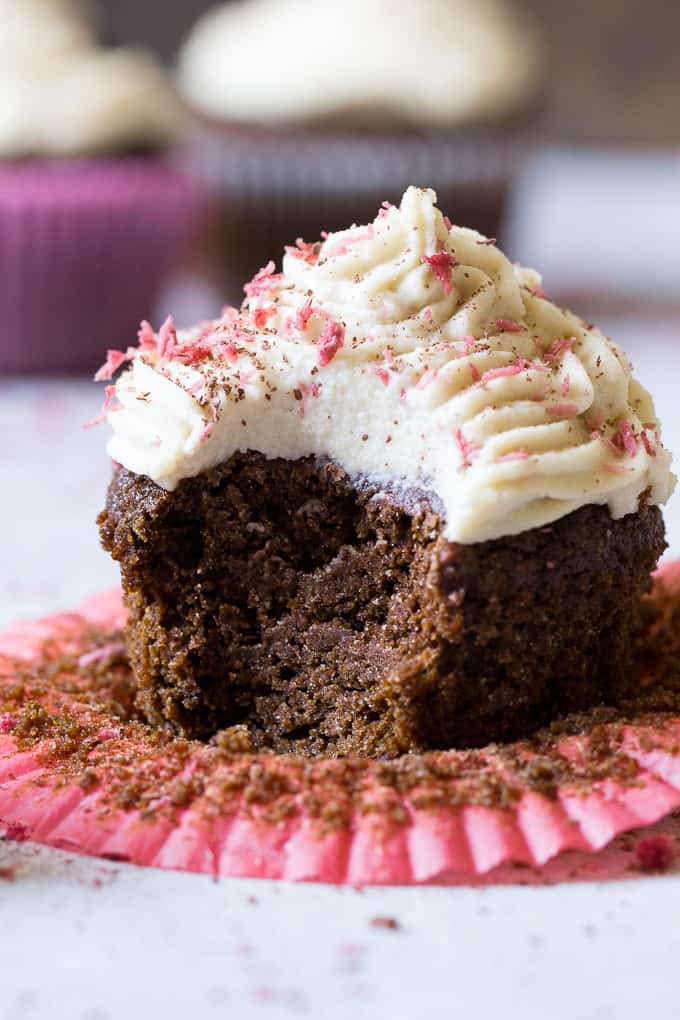 Perfect Paleo Chocolate Cupcakes (grain free, dairy free, soy free) made with coconut flour, topped with homemade coconut cashew "cream cheese" frosting and pink coconut sprinkles!