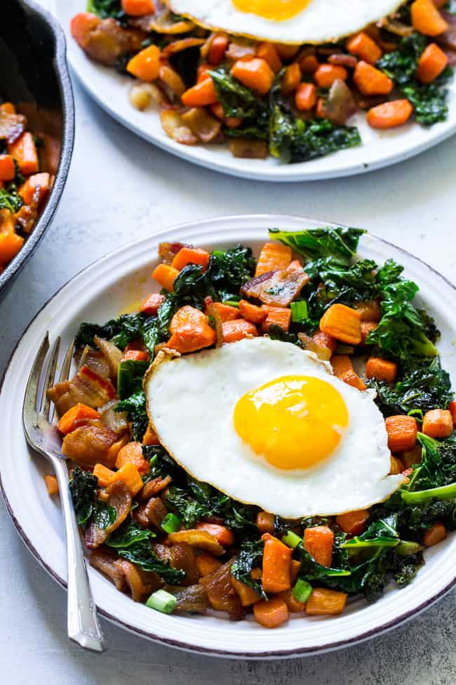 This savory roasted carrot, bacon and kale hash is great as a side dish or for breakfast topped with fried eggs! It's a lower carb alternative to the classic sweet potato hash and just as delicious. Paleo and Whole30 compliant, simple to make.