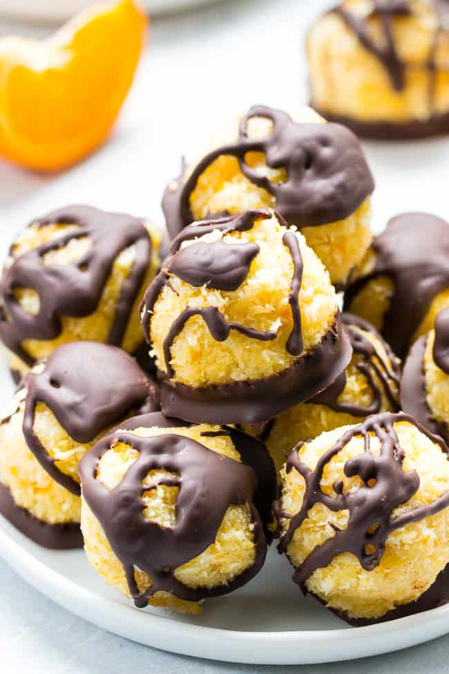 Chewy and sweet orange coconut macaroons are dipped in dark chocolate for a healthy yet decadent tasting dessert! Easy and fun to make, these delicious macaroons are gluten free, dairy free and Paleo.