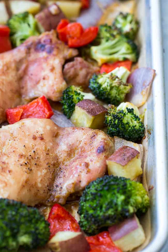 This 30 minute sheet pan chicken with veggies has a sweet and savory sauce baked right in for a complete dinner that's packed with flavor and nutrition! Gluten free, Paleo, Whole30 compliant dinner and great for weeknights and leftovers too!