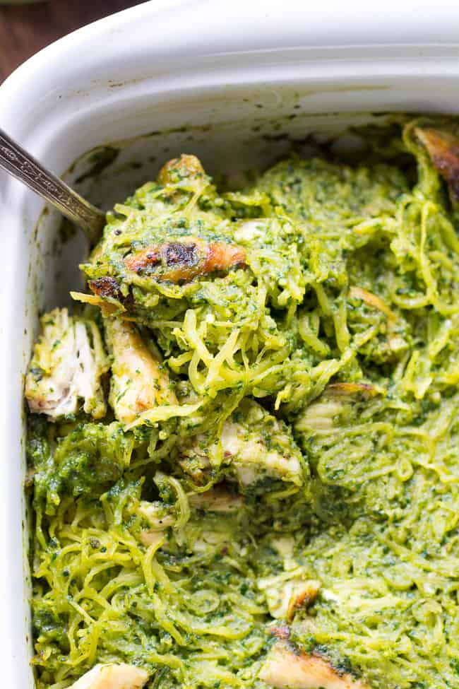 Perfectly cooked spaghetti squash is tossed with a flavor-packed Paleo & Whole30 pesto and seasoned chicken for a healthy filling meal even squash haters will love! This Paleo spaghetti squash dinner makes great leftovers too! Whole30, dairy free and low carb.