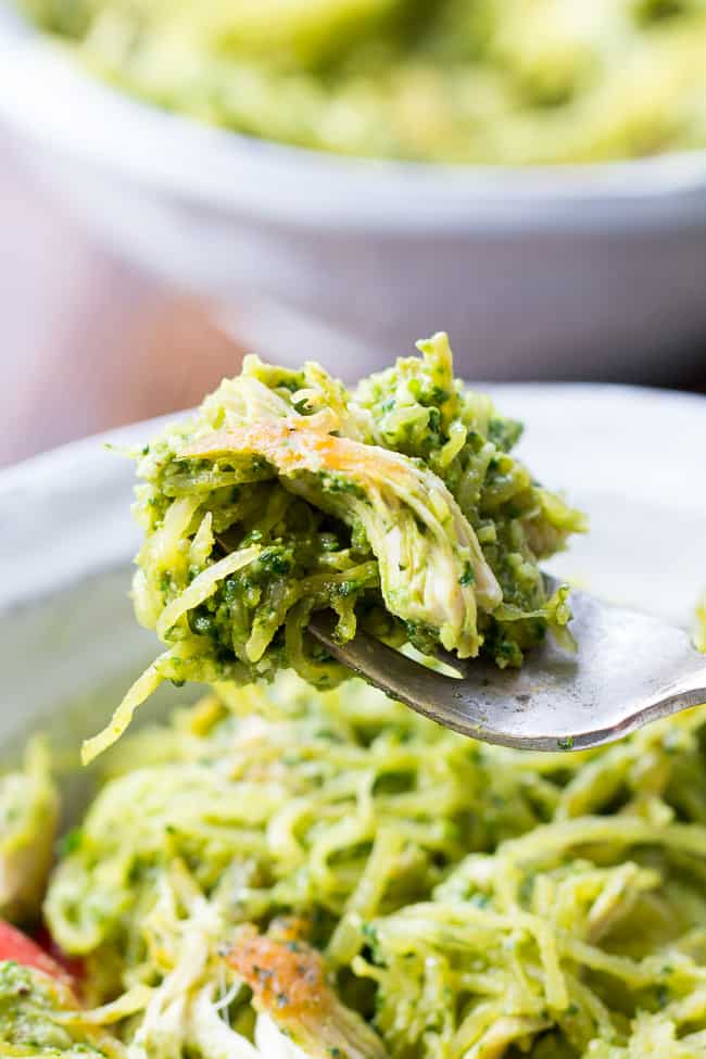 Perfectly cooked spaghetti squash is tossed with a flavor-packed Paleo & Whole30 pesto and seasoned chicken for a healthy filling meal even squash haters will love! This Paleo spaghetti squash dinner makes great leftovers too! Whole30, dairy free and low carb.