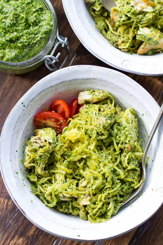 Perfectly cooked spaghetti squash is tossed with a flavor-packed Paleo & Whole30 pesto and seasoned chicken for a healthy filling meal even squash haters will love! This Paleo spaghetti squash dinner makes great leftovers too! Whole30, dairy free and low carb.