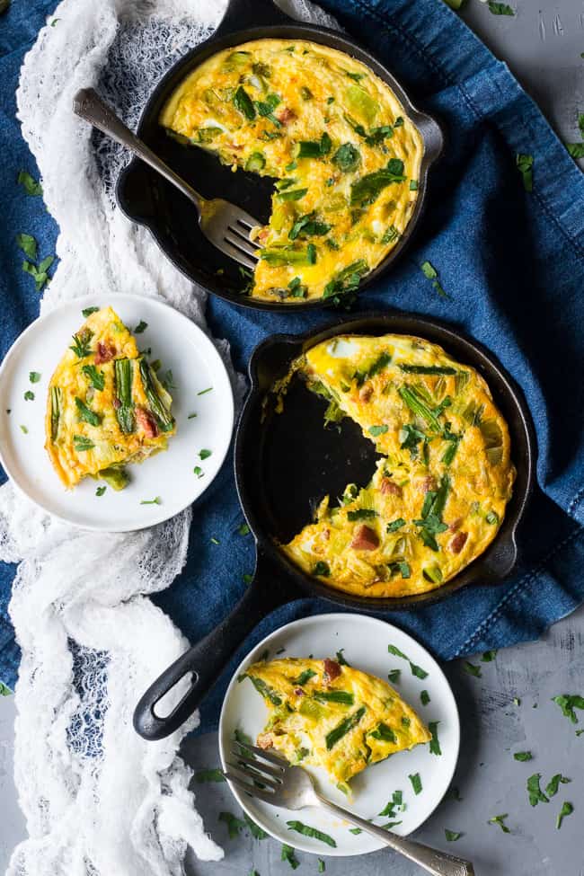 This easy, healthy asparagus frittata with spicy sausage and leeks is perfect for breakfast, brunch, or "brinnner" during the spring and summer months!  It's Paleo and Whole30 friendly, low carb, and ready in 30 minutes.  Perfect for breakfast, brunch, or breakfast for dinner!