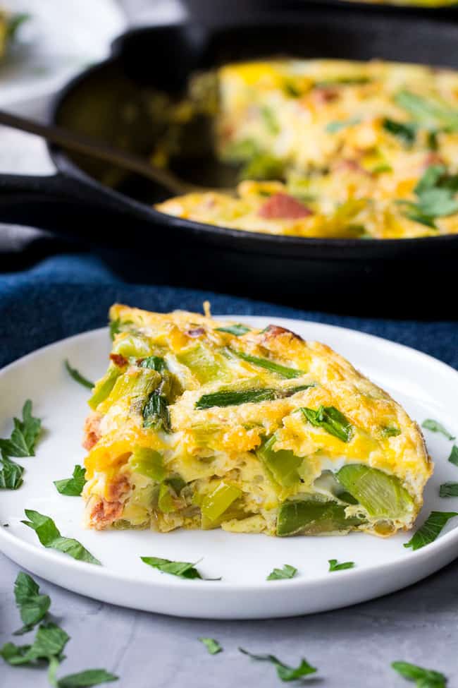 This easy, healthy asparagus frittata with spicy sausage and leeks is perfect for breakfast, brunch, or "brinnner" during the spring and summer months!  It's Paleo and Whole30 friendly, low carb, and ready in 30 minutes.  Perfect for breakfast, brunch, or breakfast for dinner!