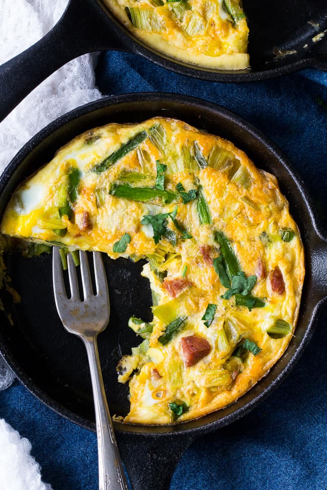 This easy, healthy asparagus frittata with spicy sausage and leeks is perfect for breakfast, brunch, or "brinnner" during the spring and summer months!  It's Paleo and Whole30 friendly, low carb, and ready in 30 minutes.  Perfect for breakfast, brunch, or breakfast for dinner!