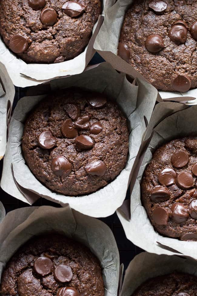 Extra rich yet super healthy double chocolate banana muffins made with tahini for a nutty flavor and moist, cake-like texture. They're gluten free, grain free, dairy free and Paleo and even kid friendly! Have one for breakfast, an afternoon snack, or anytime you need a chocolate fix.