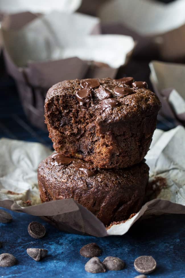 Extra rich yet super healthy double chocolate banana muffins made with tahini for a nutty flavor and moist, cake-like texture. They're gluten free, grain free, dairy free and Paleo and even kid friendly! Have one for breakfast, an afternoon snack, or anytime you need a chocolate fix.