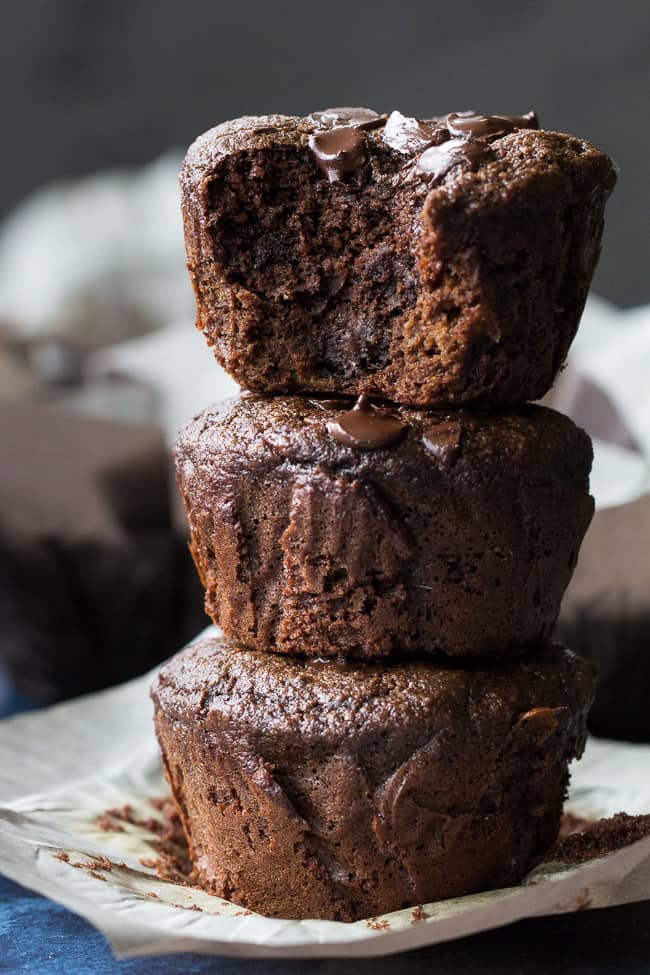 Extra rich yet super healthy double chocolate banana muffins made with tahini for a nutty flavor and moist, cake-like texture. They're gluten free, grain free, dairy free and Paleo and even kid friendly! Have one for breakfast, an afternoon snack, or anytime you need a chocolate fix.
