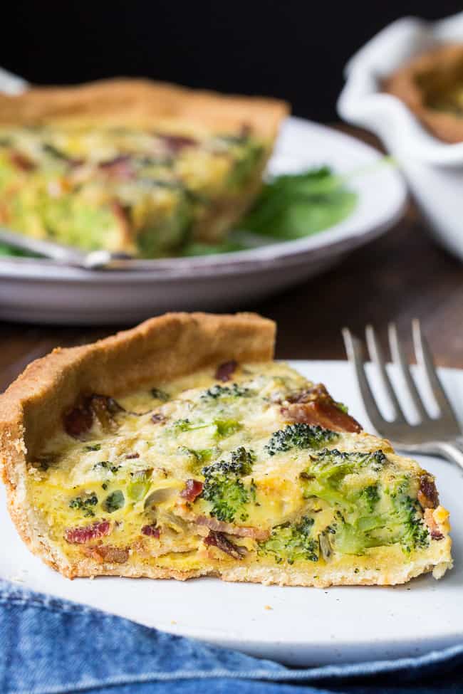 This Paleo broccoli quiche is easy to make and perfect as a make ahead breakfast or to bring to brunch for Easter, Mother's Day or anything else! It's loaded with caramelized onions, savory sautéed broccoli and crisp bacon, plus has a secret "cheesy" ingredient while remaining dairy free! Grain free, gluten free, healthy.