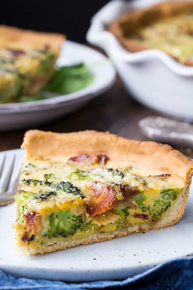 This Paleo broccoli quiche is easy to make and perfect as a make ahead breakfast or to bring to brunch for Easter, Mother's Day or anything else! It's loaded with caramelized onions, savory sautéed broccoli and crisp bacon, plus has a secret "cheesy" ingredient while remaining dairy free! Grain free, gluten free, healthy.
