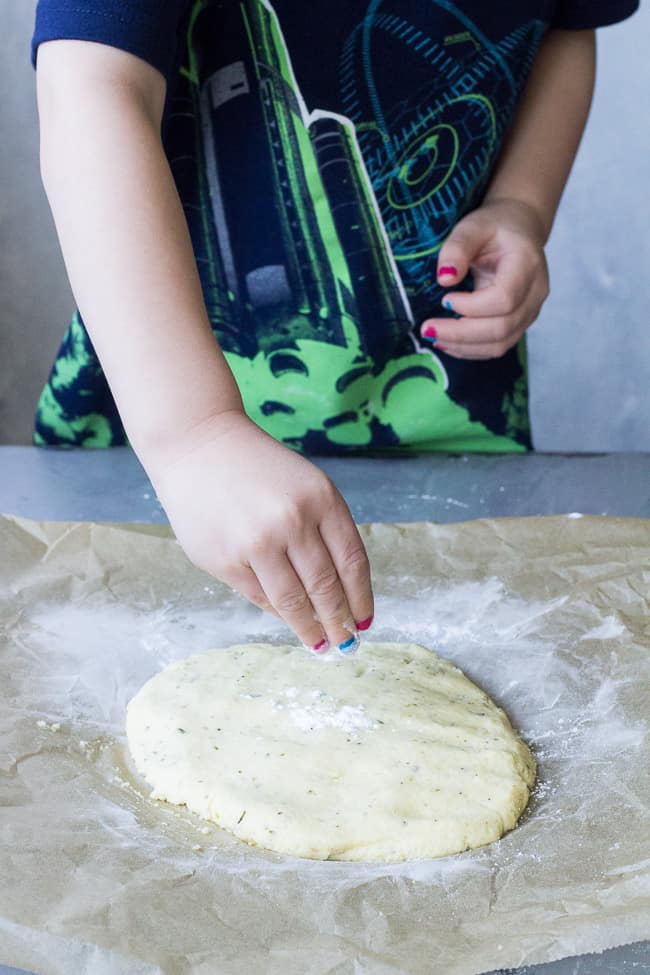 This quick and easy paleo pizza crust will be your new go-to whenever a pizza craving strikes! The ingredients mix together in one bowl and it's ready in under 30 minutes. Top it however you like for any meal! Kid friendly, gluten free, grain free, dairy free.