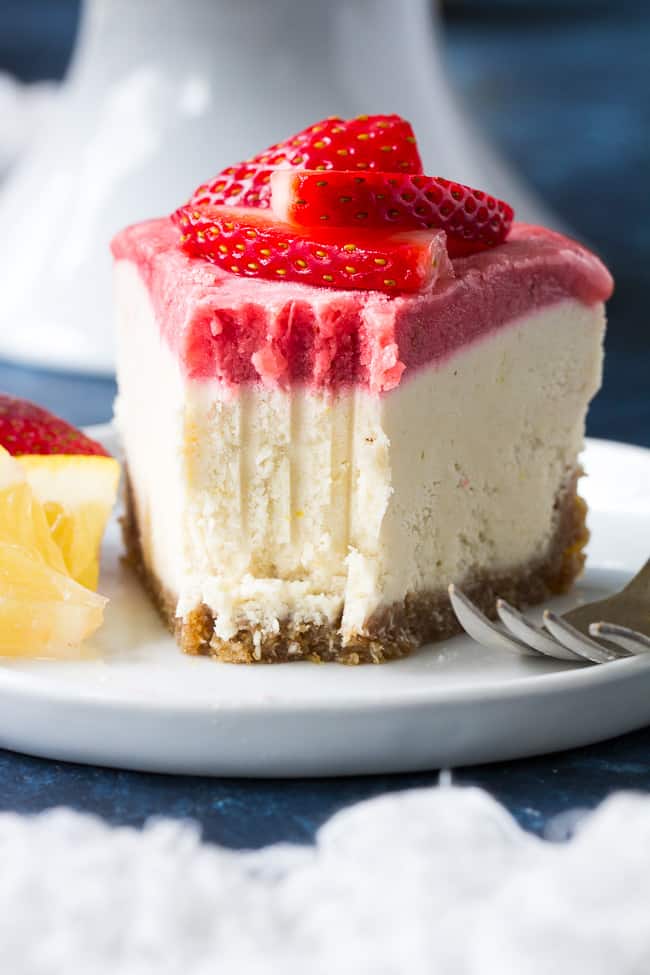 This no-bake Paleo and vegan cheesecake has a chewy, naturally sweet crust, topped with a thick creamy lemon layer and a sweet creamy strawberry layer. The cheesecake layers have a cashew base, come together quickly in a blender or food processor, and are then chilled to set. Gluten free, dairy free, refined sugar free.