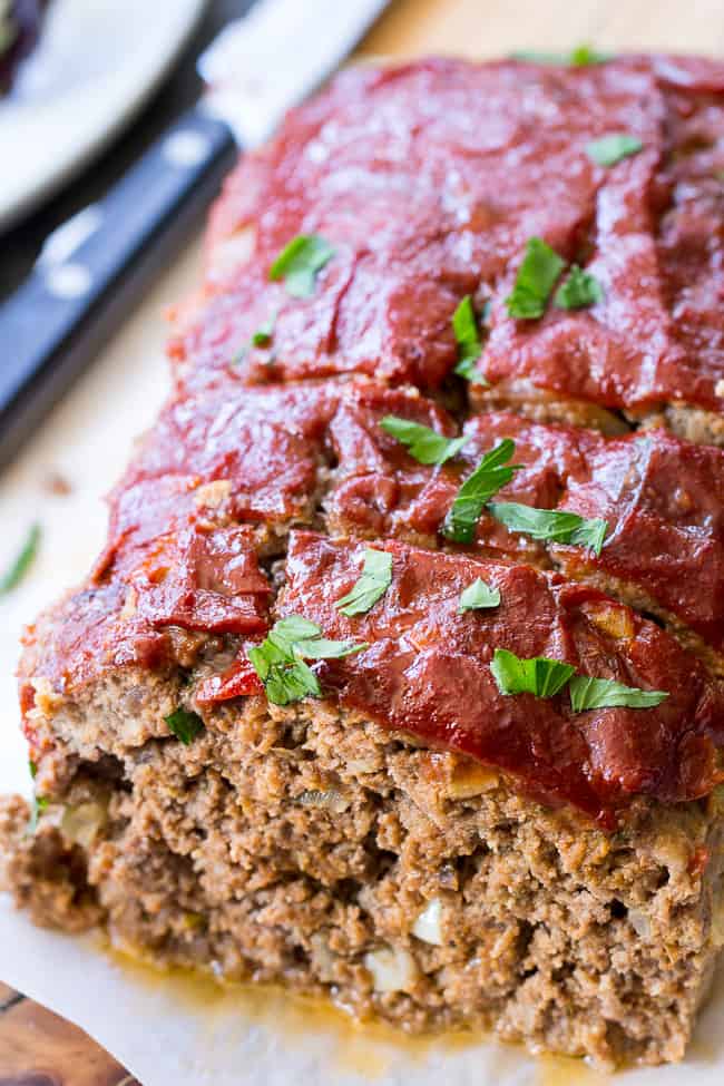 This Whole30 and Paleo meatloaf is packed with classic flavors and topped with Whole30 ketchup sweetened with dates! It's the ultimate cozy comfort food that everyone will love. Gluten free grain free, dairy free, no added sugar. Great Whole30 paleo dinner idea!