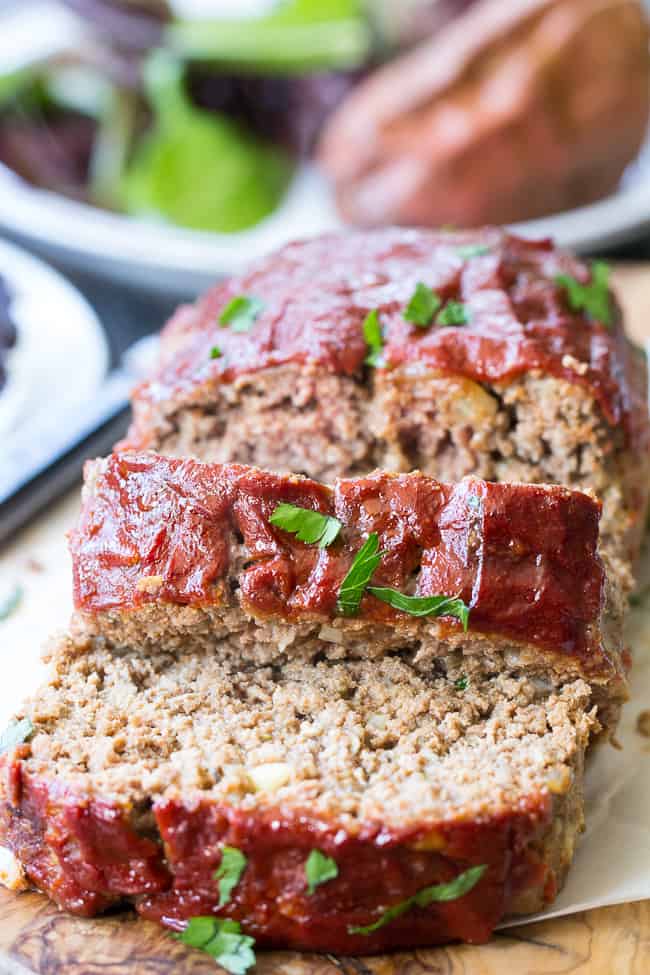 This Whole30 and Paleo meatloaf is packed with classic flavors and topped with Whole30 ketchup sweetened with dates! It's the ultimate cozy comfort food that everyone will love. Gluten free grain free, dairy free, no added sugar. Great Whole30 paleo dinner idea!